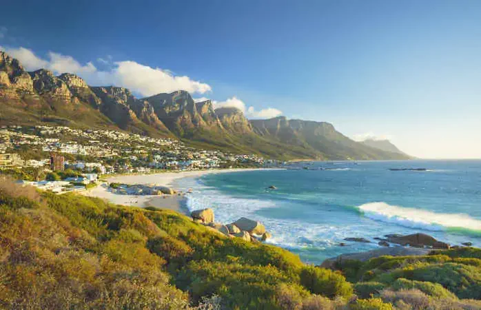 Beach and Twelve Apostles mountain in Camps Bay near Cape Town in South Africa.
